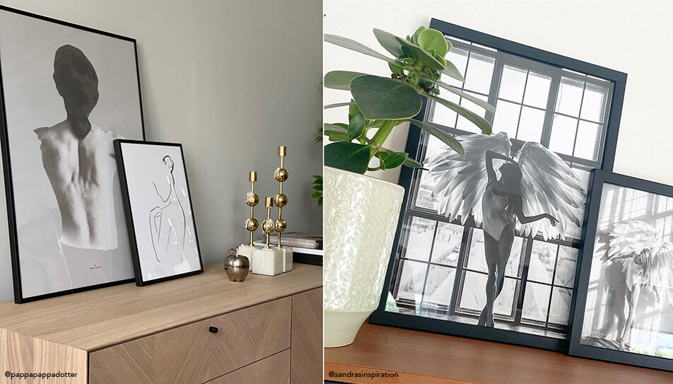 Tablouri alb-negru sprijinite pe bufet